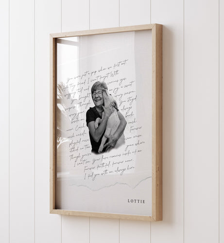 Framed artwork with a portrait and text on a white wall